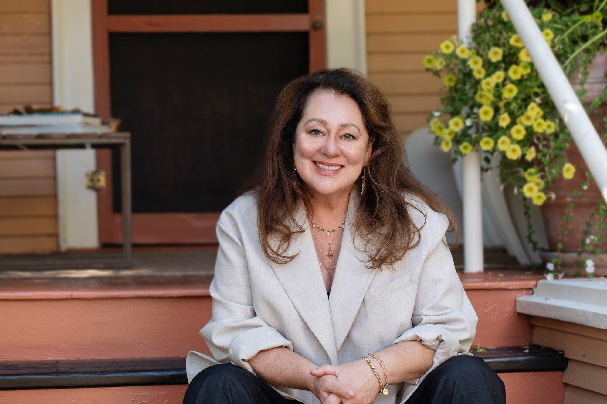 Amanda Twiss smiling on her front porch steps