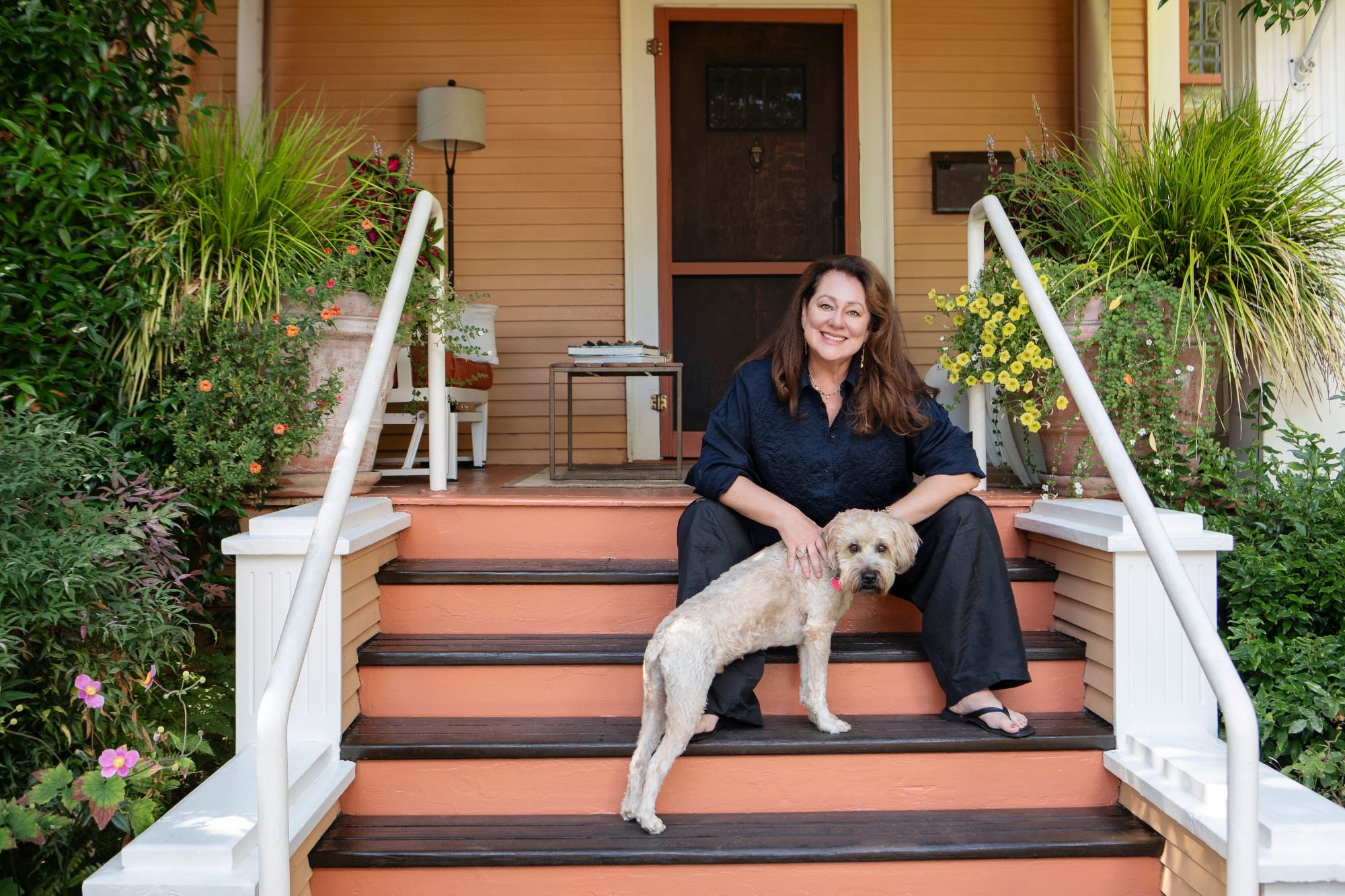 Amanda Twiss on her porch steps with her dog